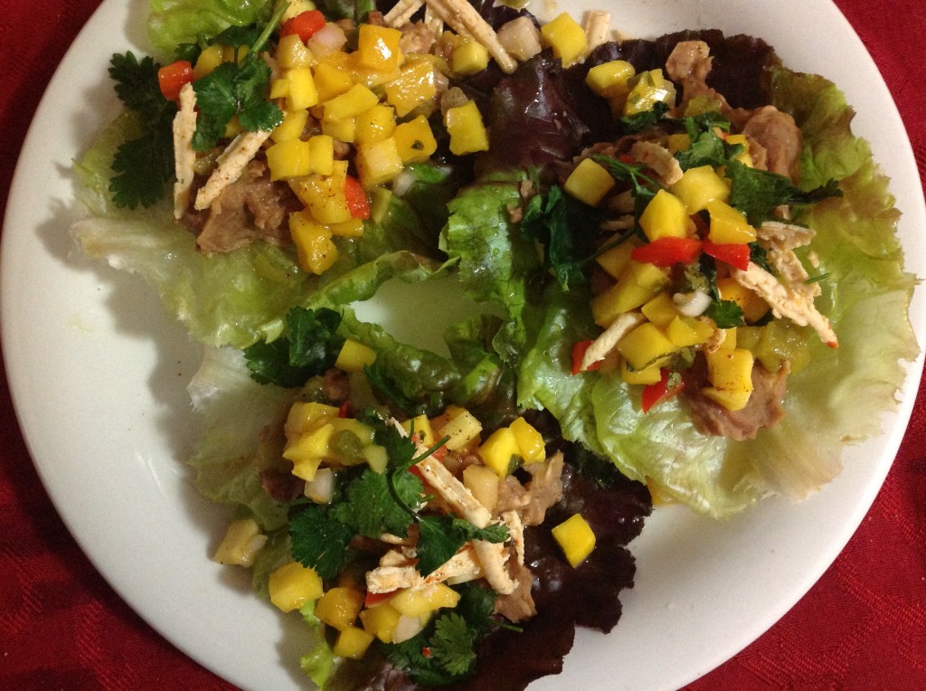 Burrito lettuce wraps with mango salsa, cilantro, vegan cheese and chiles